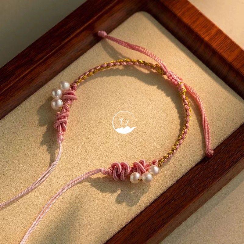 

Классный браслет из изысканного жемчуга, ручной работы, с крестообразным плетением, готовый ремешок для переноски, носимые бусины удачи, золотая нить безопасности Pink