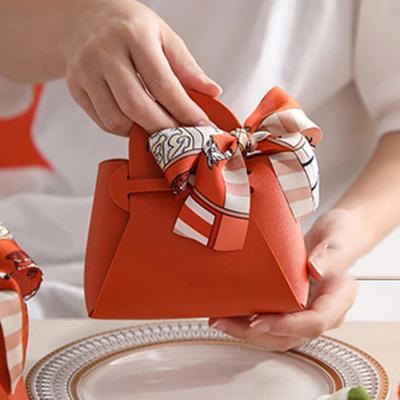 1PC Sacchetti regalo in pelle con fiocco e nastro, sacchetti per bomboniere, distribuzione di caramelle per neonati, scatola per imballaggio, mini borsa