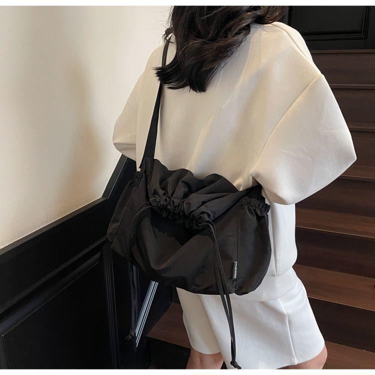 2025 Black Pleated Drawstring Tote - Large Capacity, Versatile Single-Shoulder Crossbody Bag for Casual and Commute Use.