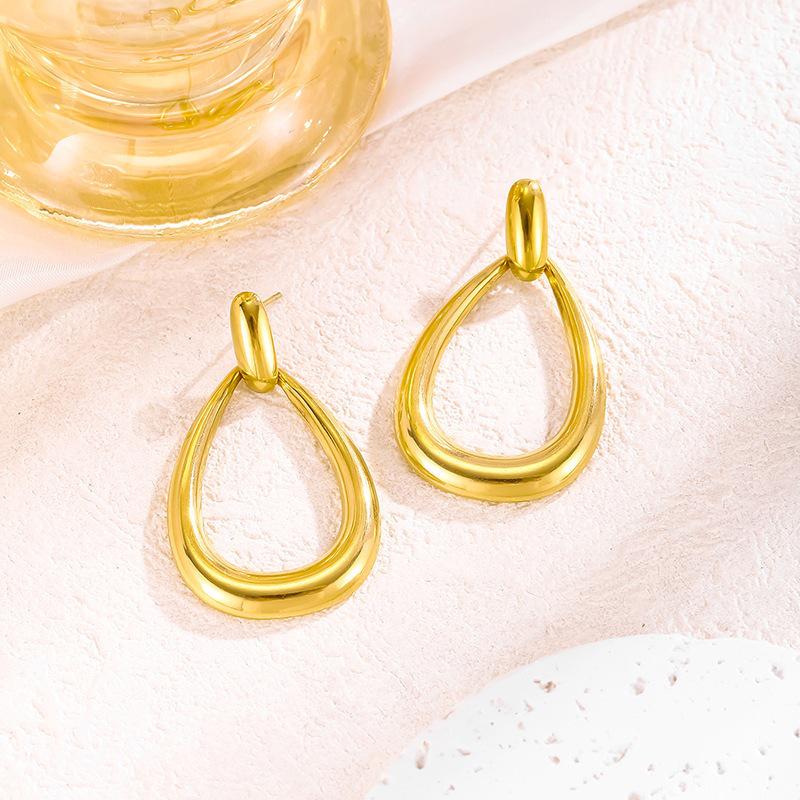 Oval Water Drop Titanium Steel Earrings for Women - Elegant French-European Style, Hollow Design, Exaggerated Studs, High-End Fashion.