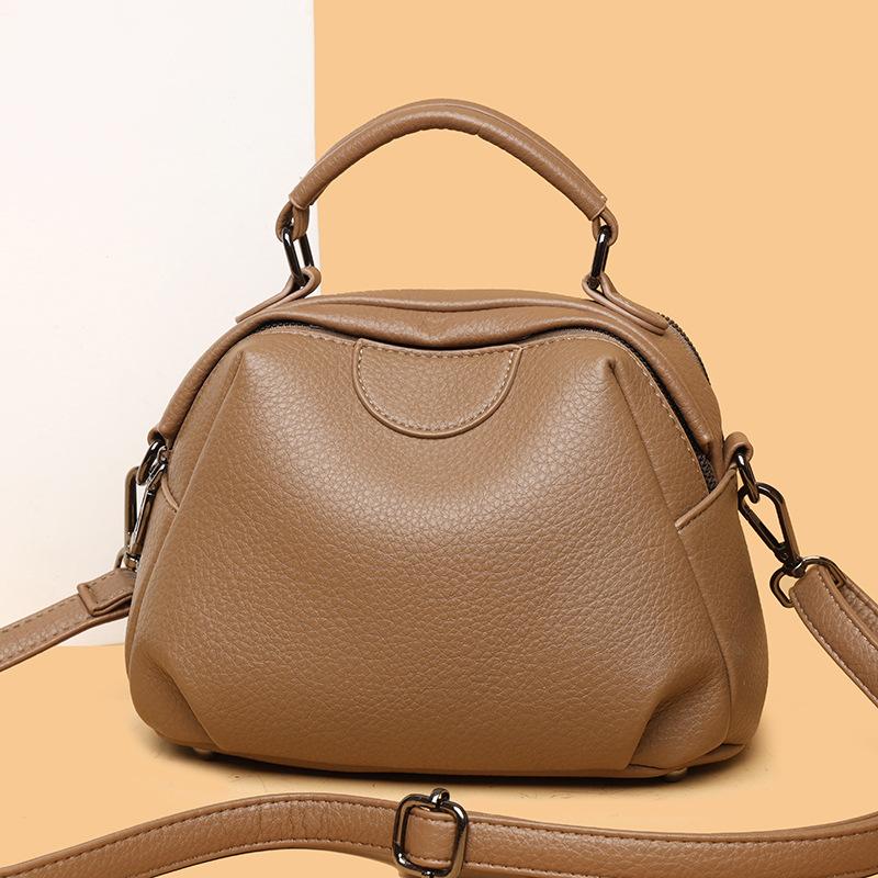 New hand-carried oblique straddle bag large-capacity fashionable and casual retro women's shoulder bag cowhide pattern simple bucket bag