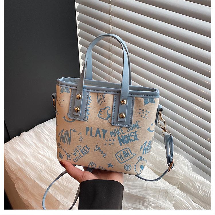 Contrasting color big bag women's 2025 autumn and winter new cute cartoon printed shoulder bag versatile trendy tote bag