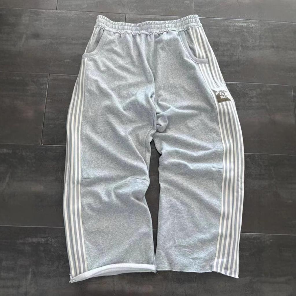 Unisex volné pruhované tepláky širokého střihu