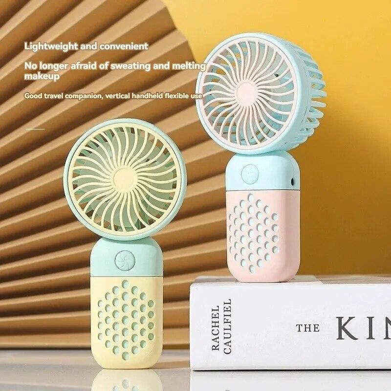 Handventilator mit Ladefunktion, Cartoon-Design, kleiner Ventilator für Schüler, der kleinen Ventilator auflädt, tragbarer Mini-Taschen-USB-V