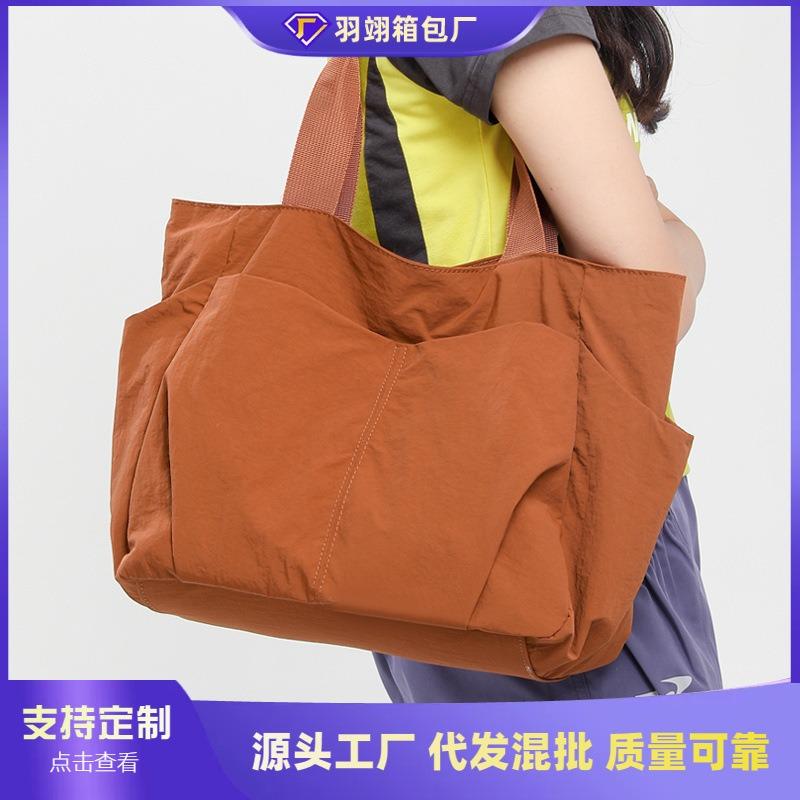 Large-capacity simple casual shoulder bag women's new versatile lightweight tote bag class commuter bag