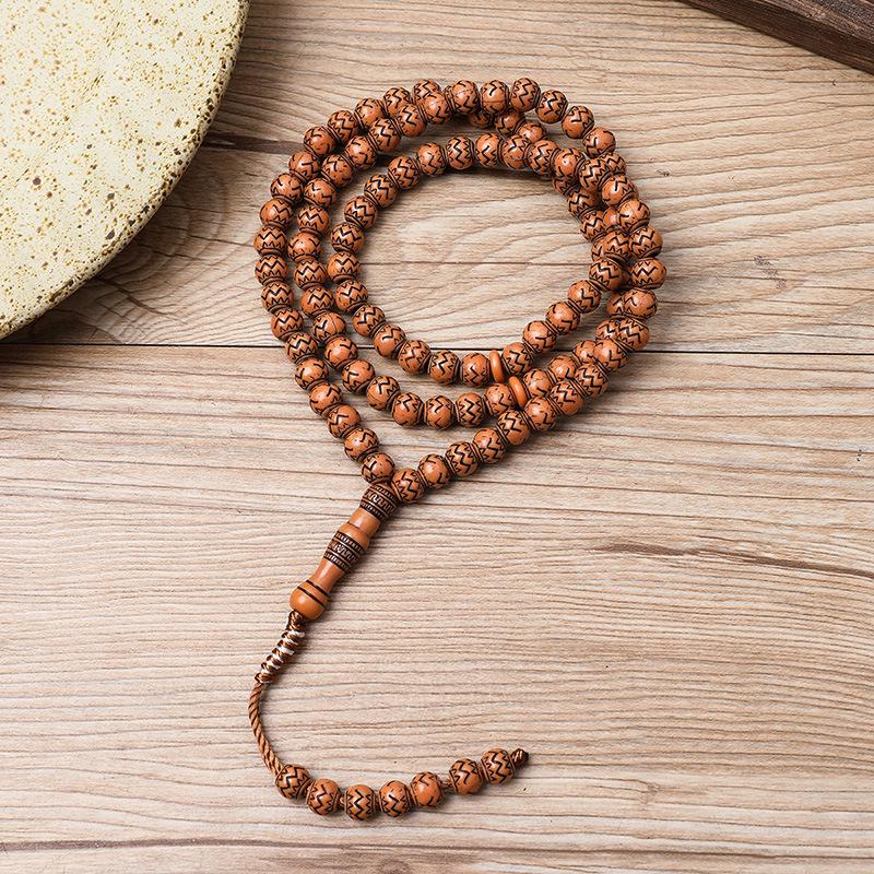 Ručně vyráběný 99-korálkový růženec Tasbih s imitací dřevěné kresby ze Saúdské Arábie