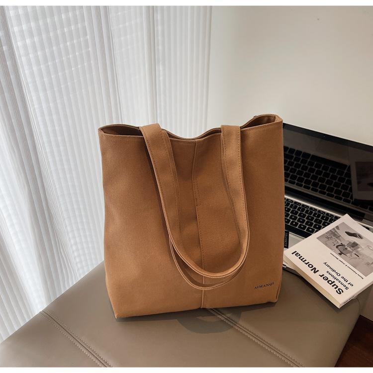 

Fashion trend casual simple large capacity canvas bag 2025 summer new foreign style women shoulder tote bag