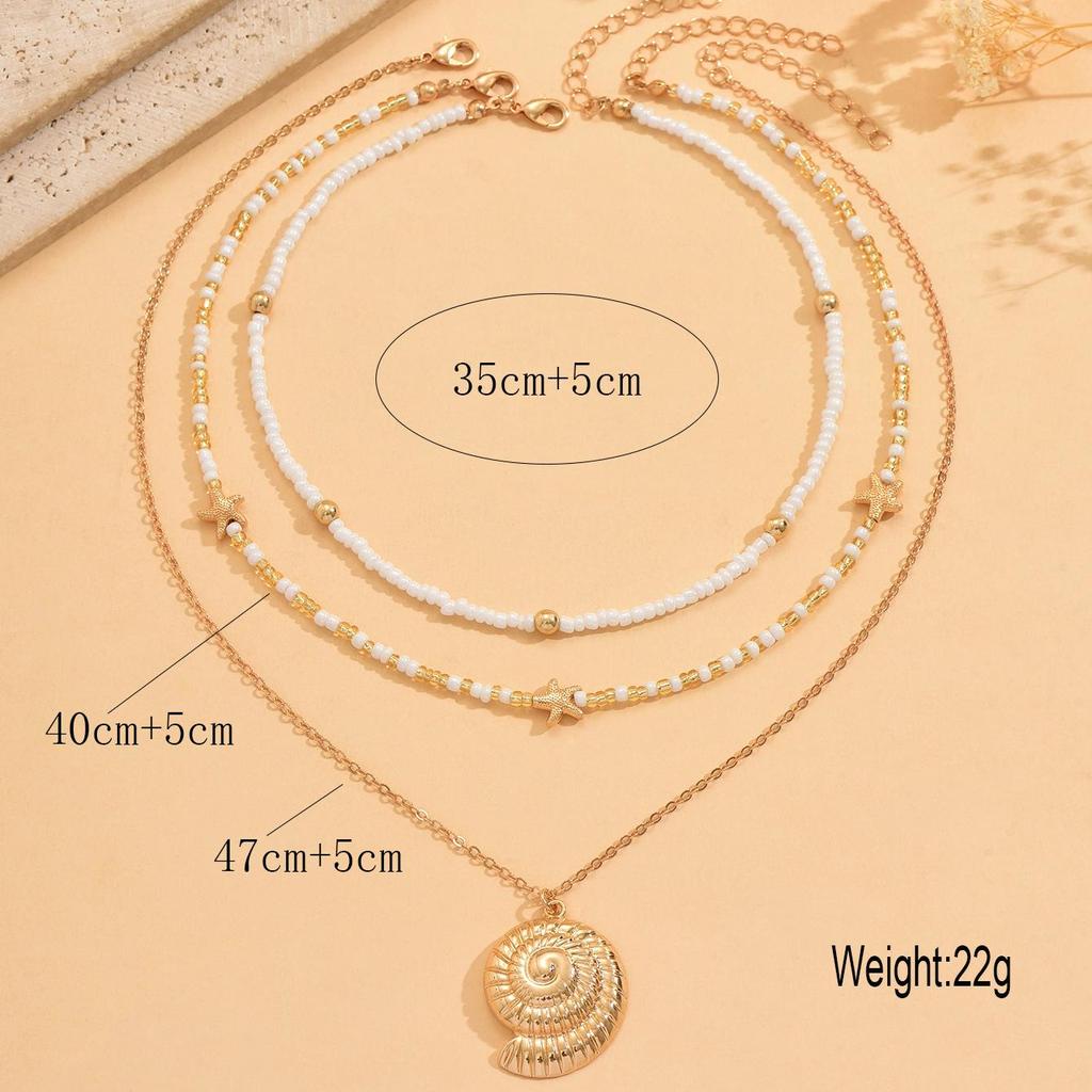 Starfish & Conch Pendant Necklace - Versatile Fashion Jewelry with Rice Bead Clavicle Chain for Women.