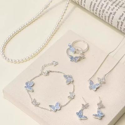 1PAQUET 2025 nouvelles boucles d'oreilles été lumière luxe niche clous en cristal haute qualité tempérament exquis kyanite papillon