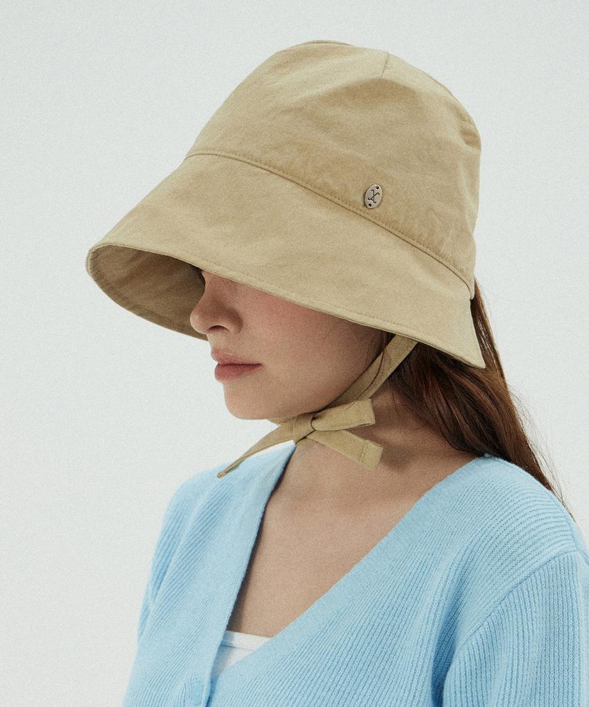 Bajal Va Curved Oval Metal Bonnet Hat Beige