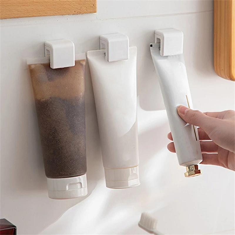 

1/2/3pcs Toothpaste Facial Cleanser Clip Wall Mounted Self-adhesive Hanging Rack Punch Free Storage Hook Bathroom Organize