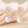 New fashion temperament pearl pendant full of diamonds flower stud earrings high-end niche design literary and artistic fan earrings earrings