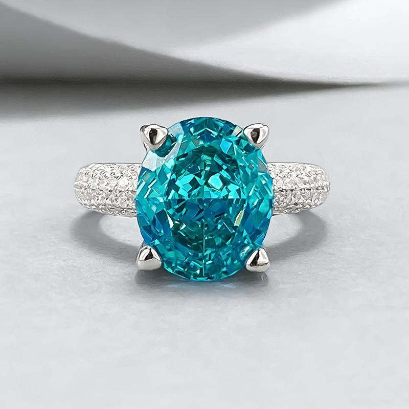 Xiancan Jewelry S925 Silver Oval Paraiba Ice Flower Cut Ring with High Carbon Diamond.