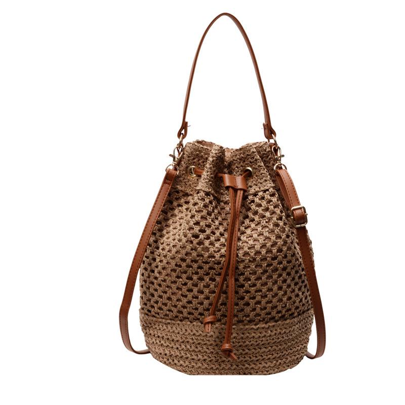 Spring and Summer New Fashion Mori Hollow Woven Portable Bucket Bag Fashion Leisure Commuting Vacation Drawstring Messenger Bag