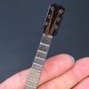 Wooden Mini Guitar Model with Stand Tiny Classical Guitar Figurine Miniature Musical Instrument Ornament Home Office Desktop Decoration