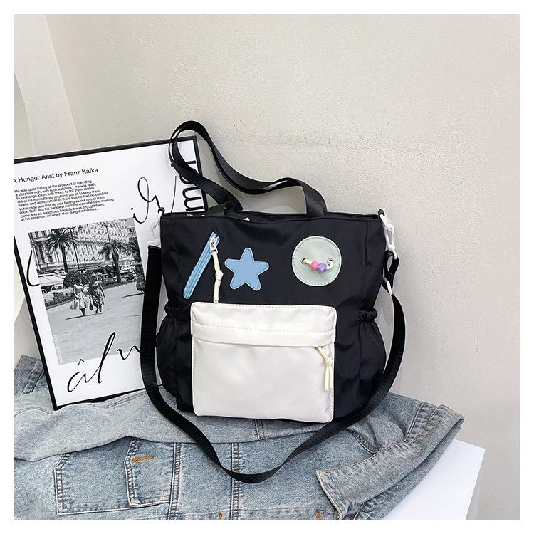 New splicing contrasting color handbag, class commuting shopping tutoring shoulder bag, light literary and artistic burden reduction messenger bag