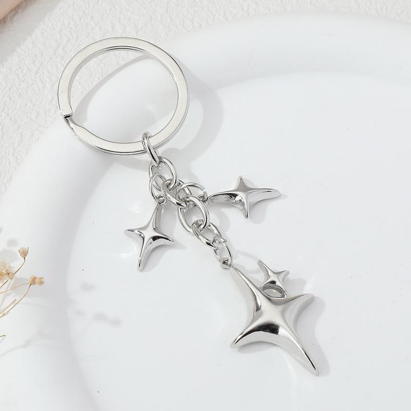 Elegant Star and Moon Hollow Keychain - Unisex Fashion Bag Pendant.