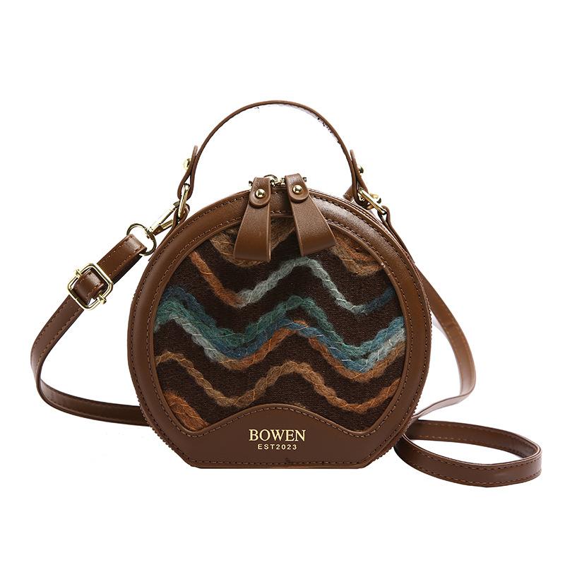 This year's popular bag women's 2025 new wavy pattern small round bag Korean version fashionable personalized portable shoulder bag women's bag