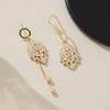 Asymmetrical zircon leaf earrings, high-end light luxury studs, 1011 new trendy niche design temperament earrings