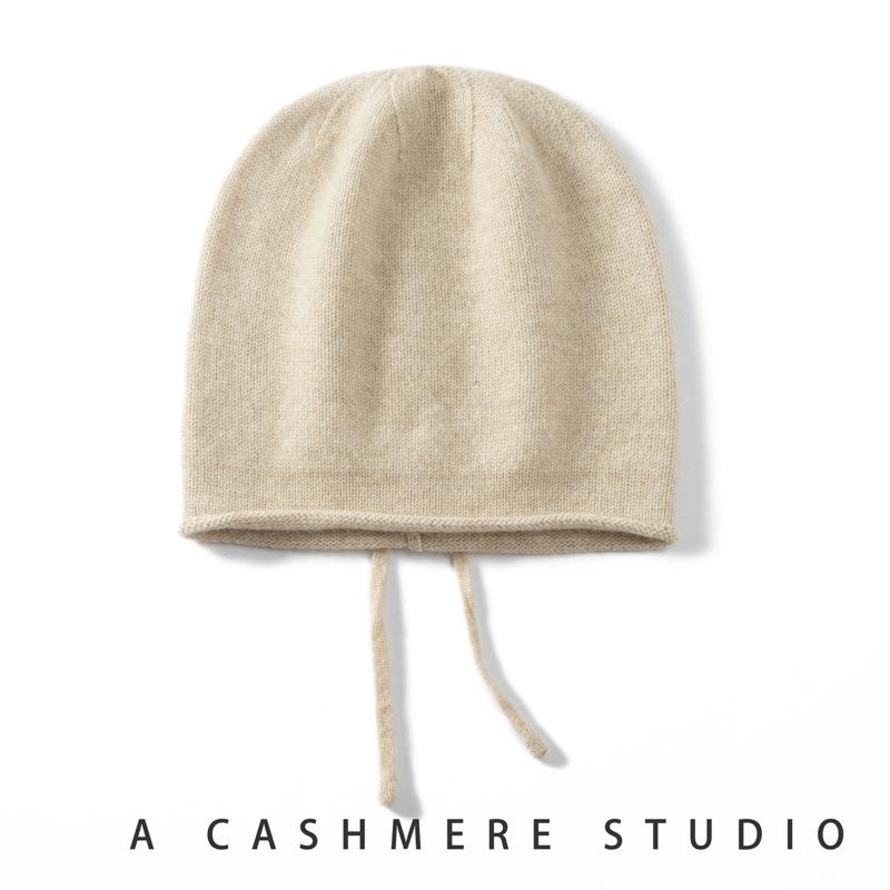 Autumn and Winter New Cashmere Women's Knitted Hat Drawstring Warm Ear Protection Fashion Hat Crimping Stack Hat Cold Hat