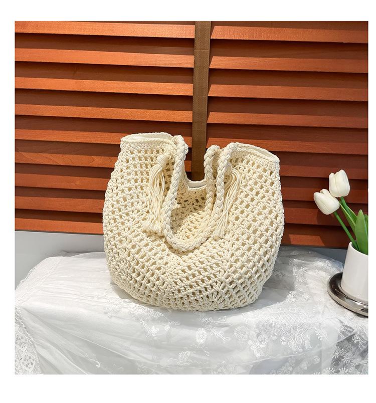 

Плетеная сумка большой вместимости 2025 новая полая соломенная сумка сумка через плечо отпуск пляжная сумка тоут женская сумка белый