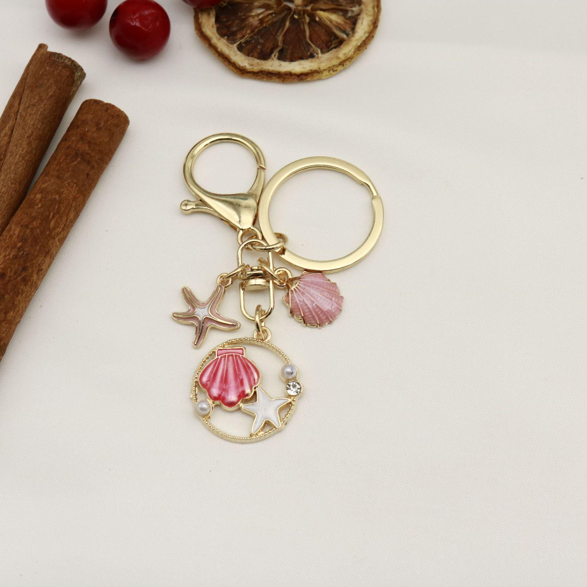 Ocean Series Charm: Starfish, Shell, Dolphin, Turtle, and Mermaid Tail Keychain Pendant.