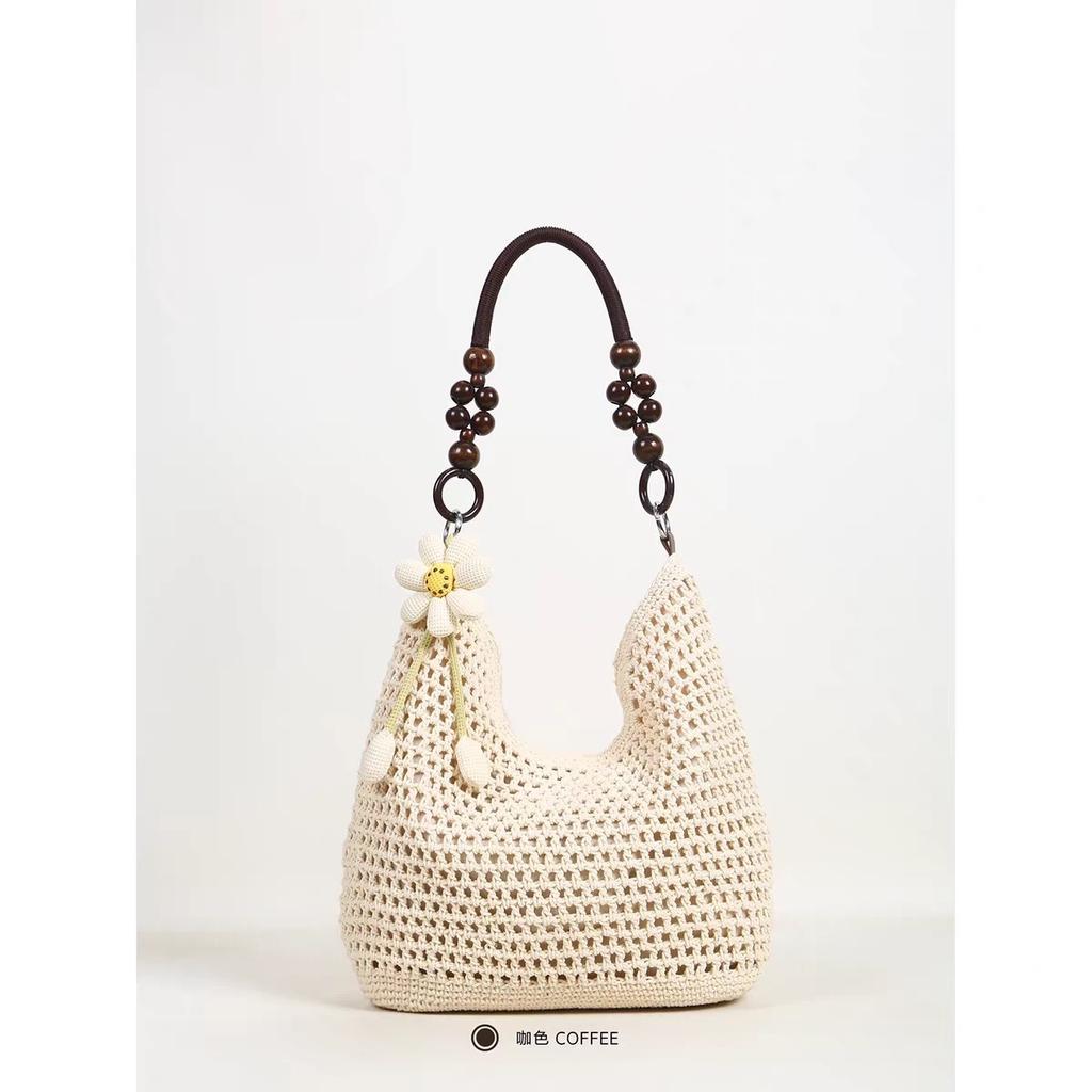 Spring new seaside beach bag women's large-capacity hollow woven shoulder bag versatile portable tote bag
