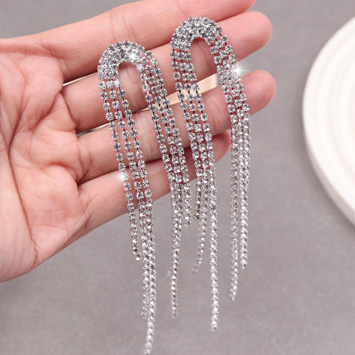 

Пара преувеличенно больших серег, женский длинный стиль, для круглого лица с бриллиантами для похудения, модная и трендовая личность серебряный