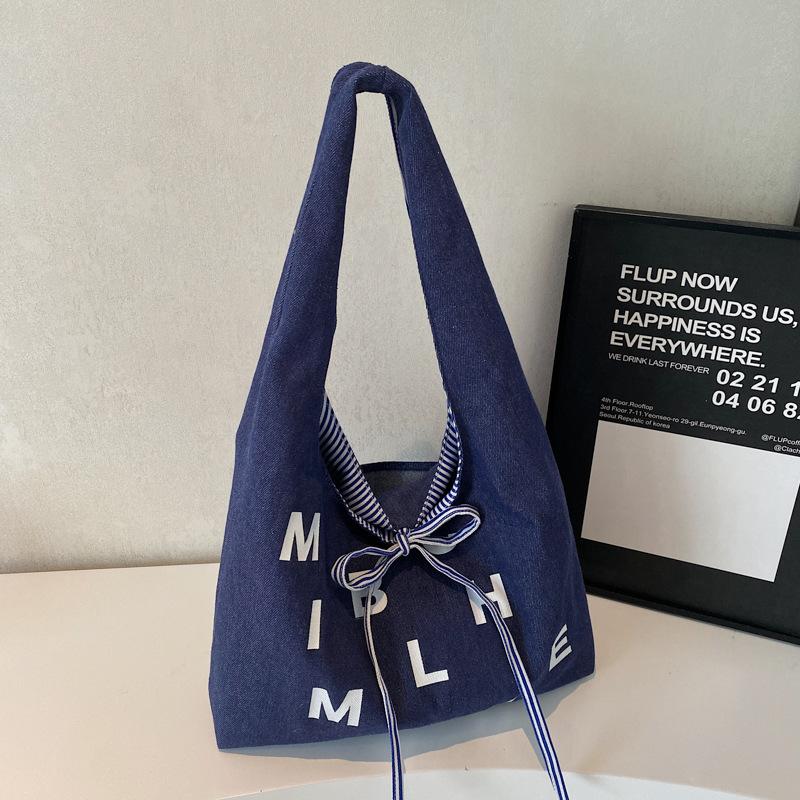 

Large capacity double-sided canvas bag women s 2025 new color letter bow shoulder bag fashion student schoolbag