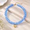 Adjustable Beaded Pendant Necklace with Rounded Resin Beads, Heart-Shaped Center Pendant, Extension Chain, and Lobster Clasp