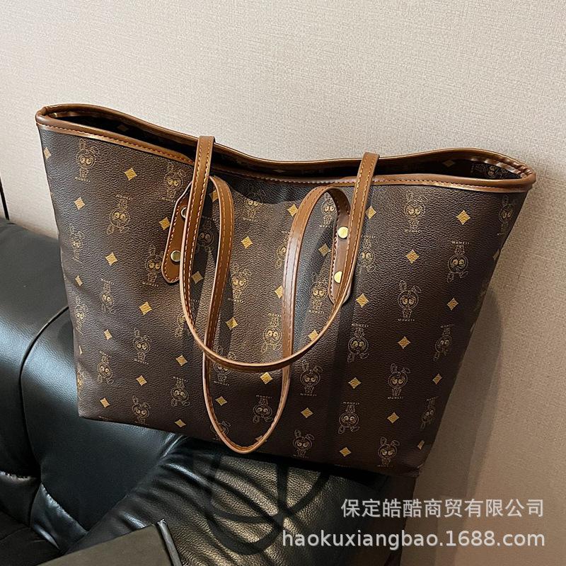 Frühlings- und Sommer-Großraumtasche 2025 neue Damenhandtasche Mode Pendler Retro Umhängetasche Studentin Unterricht Tragetasche