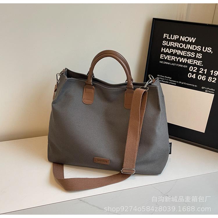 

Casual simple tote bag large capacity women s bag 2025 new commuter messenger bag fashionable women s shoulder canvas bag