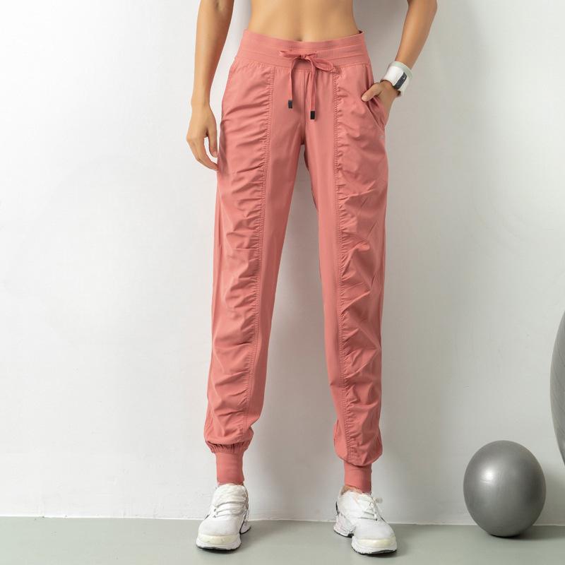 Bağcıklı Bel ve Yan Cepli Kadınlar İçin Hızlı Kuruyan Atletik Jogger Pantolon - Koşu ve Antrenman İçin Slim Fit, Nefes Alabilen Polyester Karışımı