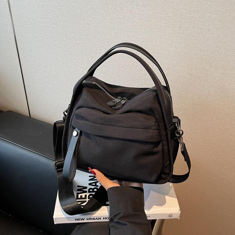 Japanese casual versatile nylon cloth small bag 2025 new fashion portable shoulder bag commuter messenger bag