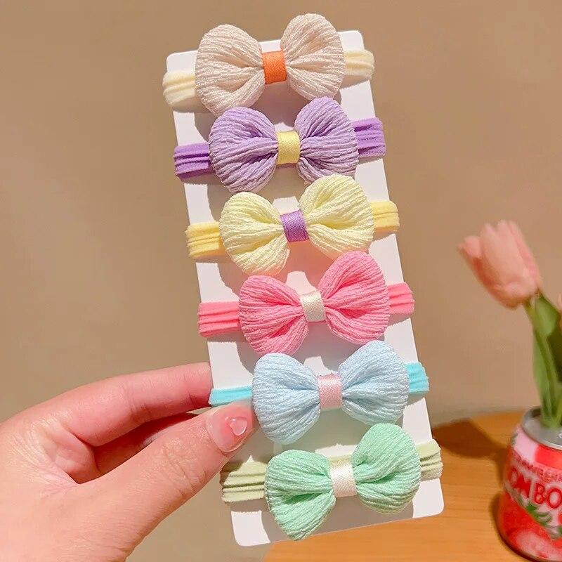 6 pièces filles nœud papillon bandes de cheveux couleur bonbon fleur cheveux cravates enfants élastiques bandes de caoutchouc élastique pour queue de cheval enfants accessoires de cheveux