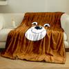 A smiling cartoon bear face on a brown background. for all seasons blanket lunch break throw gift