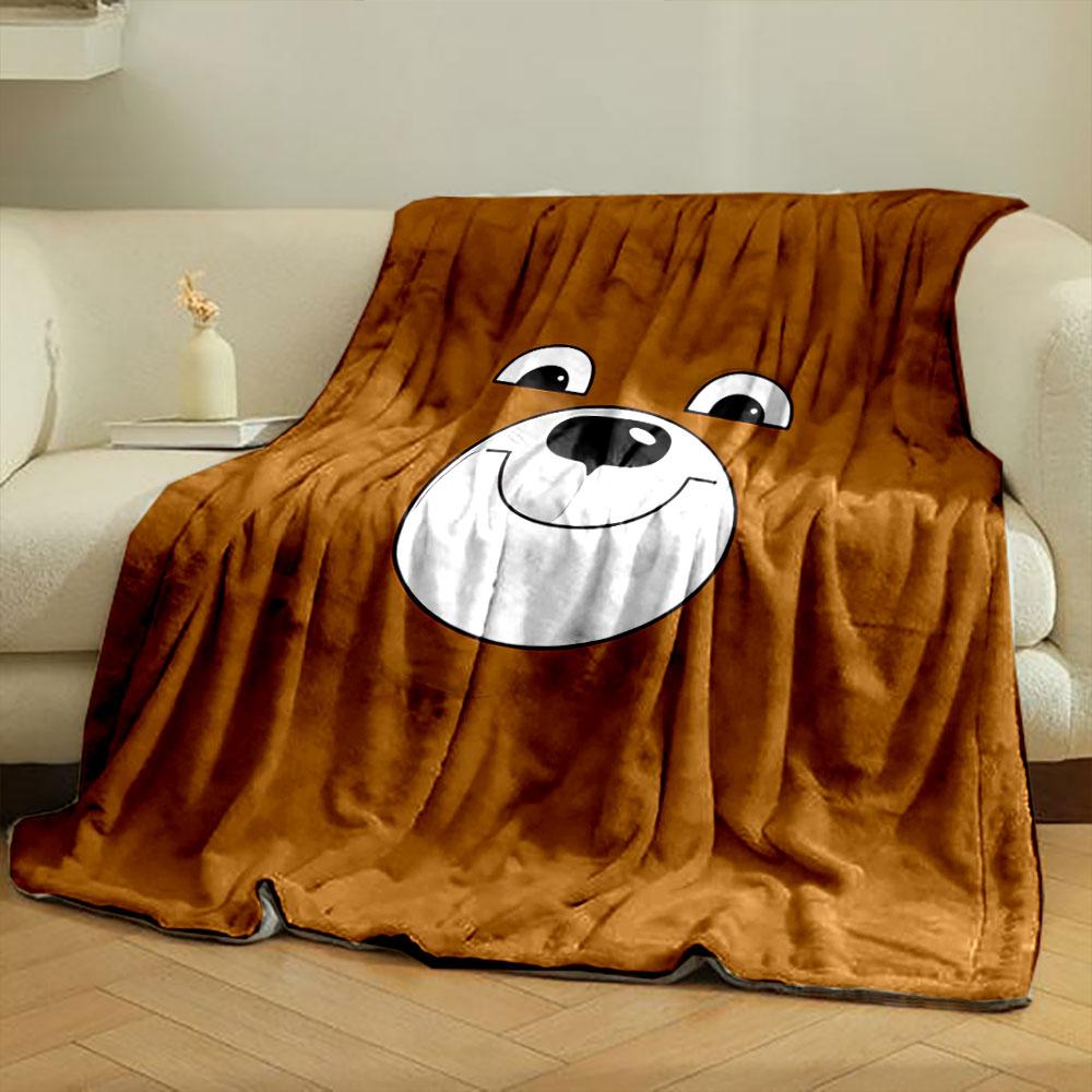 A smiling cartoon bear face on a brown background. for all seasons blanket lunch break throw gift