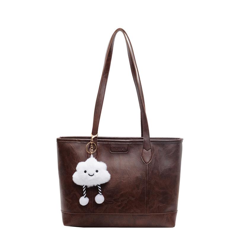 

2025 autumn and winter new large-capacity commuter tote bag women s shoulder bag splicing contrasting color casual handbag Send pendant