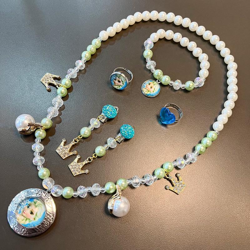 

Набір ювелірних прикрас Ельзи з мультфільму «Крижане серце»: Набір прикрас: намисто, браслет, сережки та каблучка для дітей