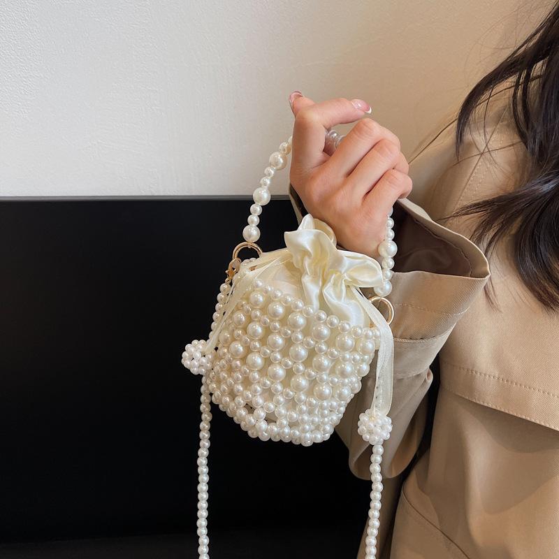 Premium bag 2025 spring new fashion woven pearl bucket handbag crossbody hollow bag