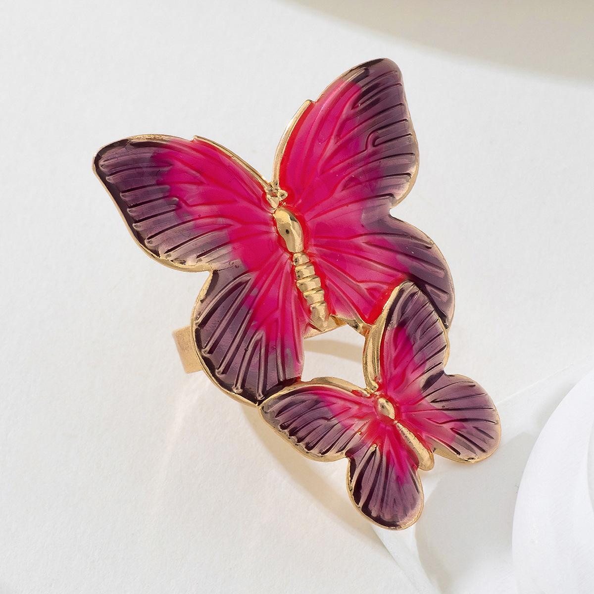 

Простое полое женское кольцо-бабочка розовый