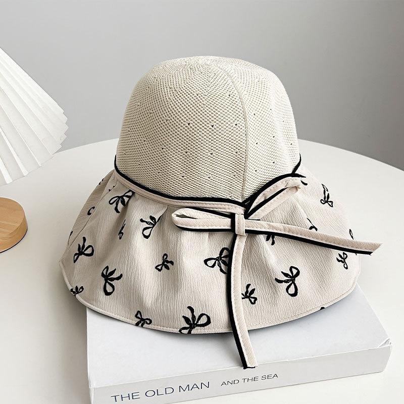 Hat women's spring and summer new bow knitted empty top hat vinyl sunscreen beach sunshade printing folding sun hat