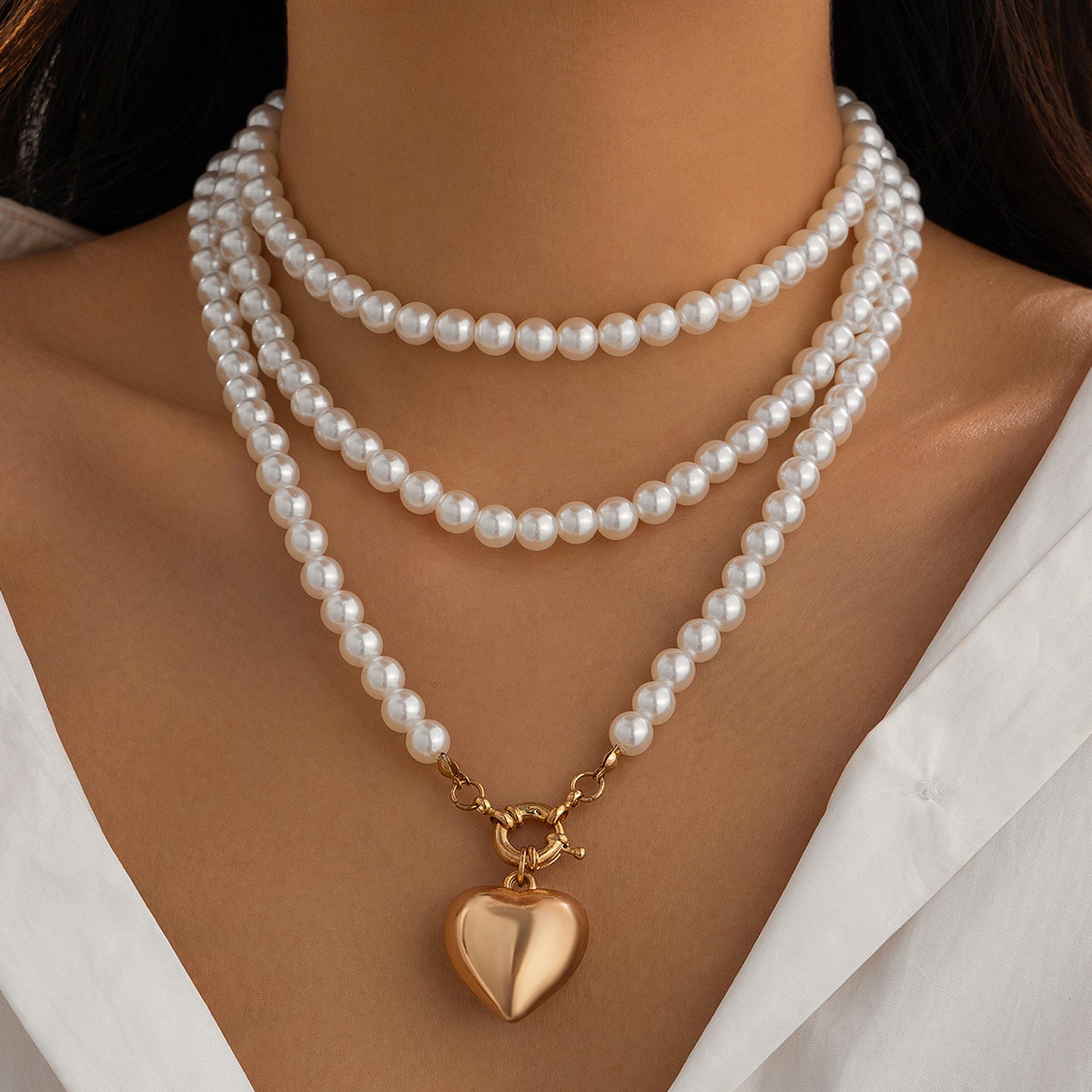 

European and American Peach Heart Pendant Necklace: Women s Fashionable Long Pearl & Clavicle Layered Chain.