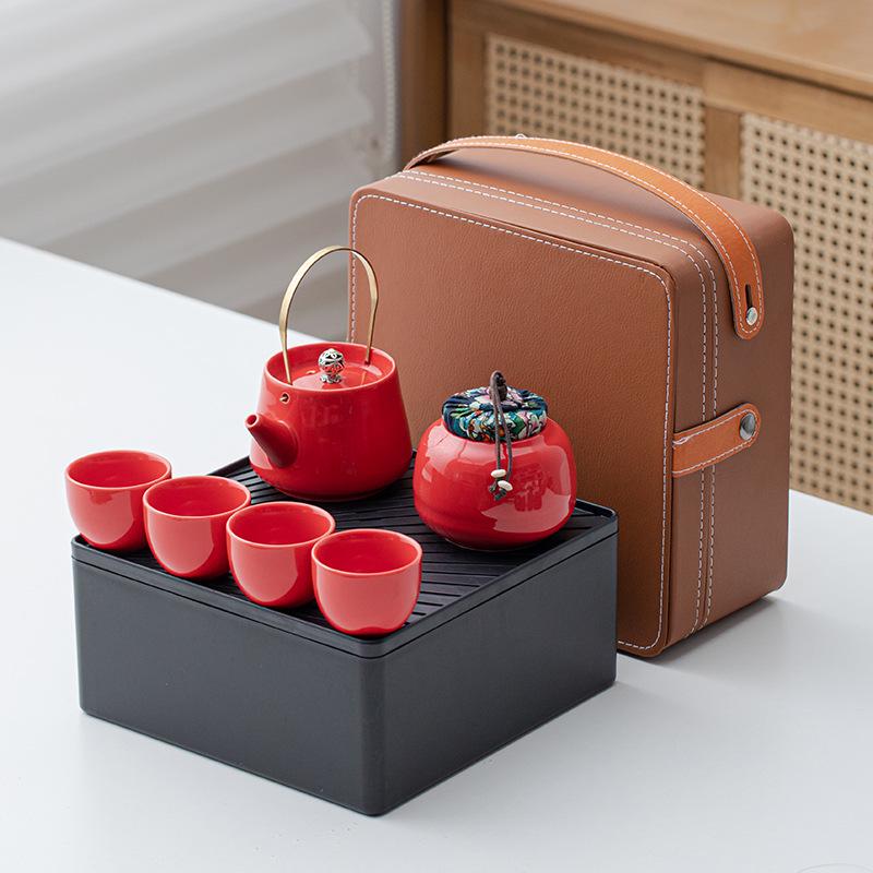 Portable Ceramic Kung Fu Tea Set: Teapot with Handle and Four Cups for Travel and Business Gifting