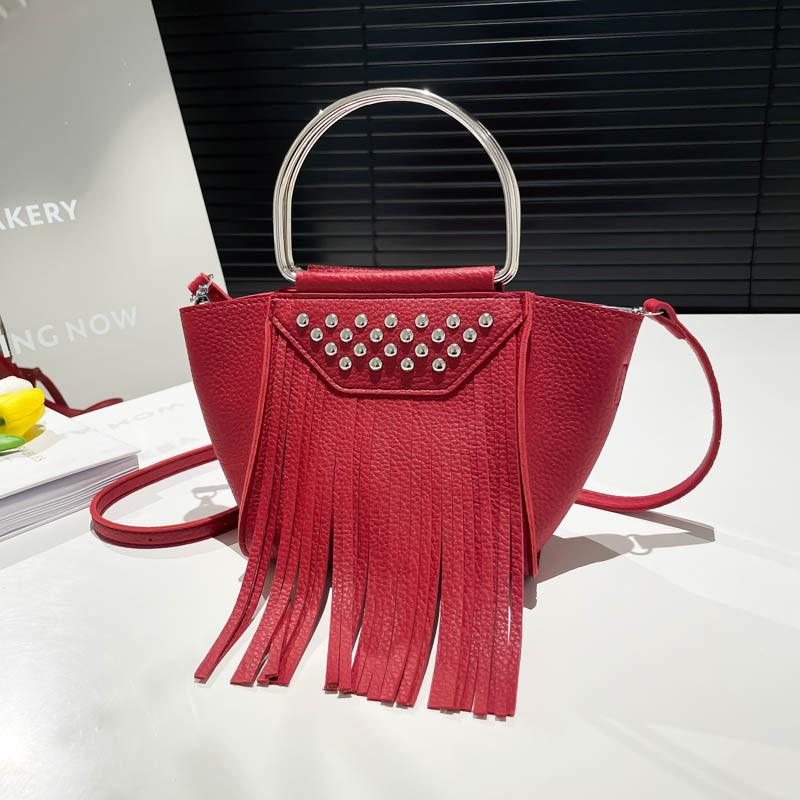 Women's bag spring and summer new 2025 Korean version fashion rivet shoulder bag personalized tassel messenger bucket bag pu