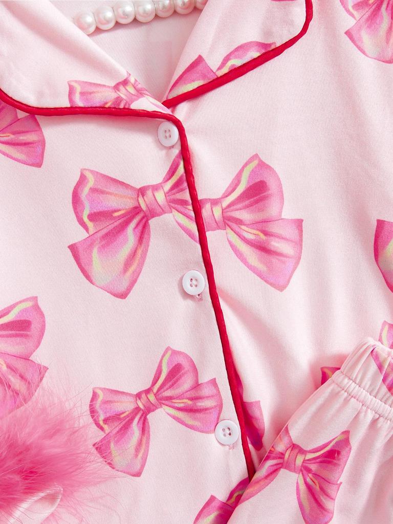 Dziewczęcy zestaw piżamowy z długim rękawem i nadrukiem kokardek, ozdobiony piórkami