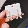 Silver Needle New Super Fairy Temperament Bow Earrings Women's Light Luxury Niche Versatile Pearl Stud Earrings