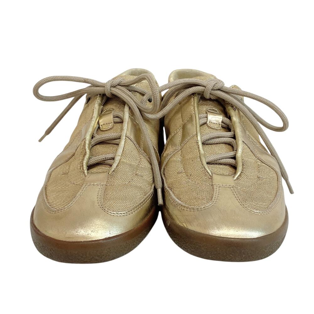 Gucci Niedrig geschnittene Leder-Sneaker goldfarbenes Leder Gebraucht