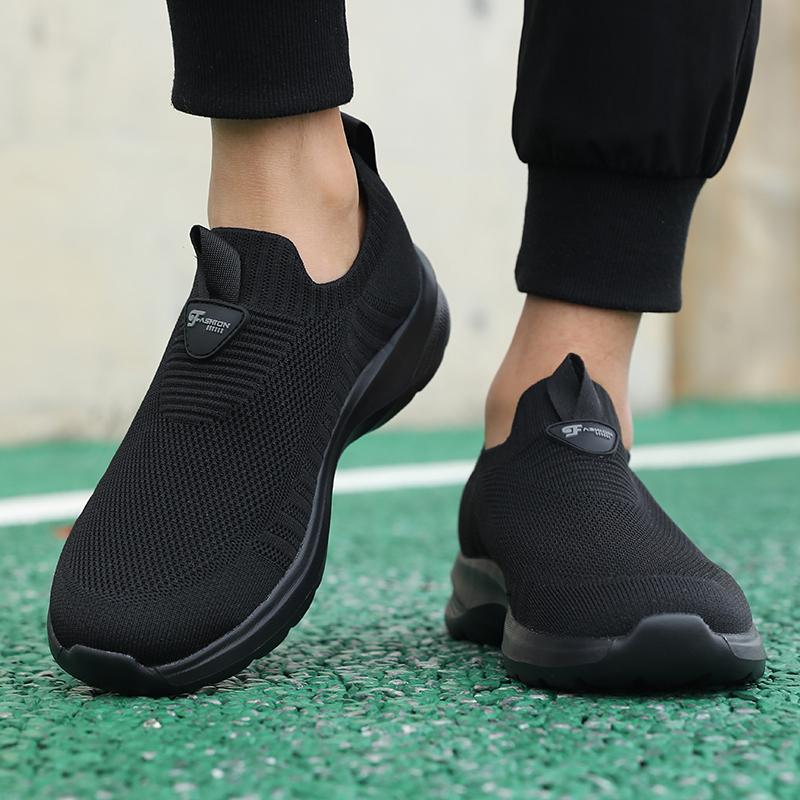 Men's Slip on Knit Sneakers Comfort Breathable Mesh Flats Shoes Lightweight EVA Sole Outdoor Sport Tennis Shoes Fashion Sneakers