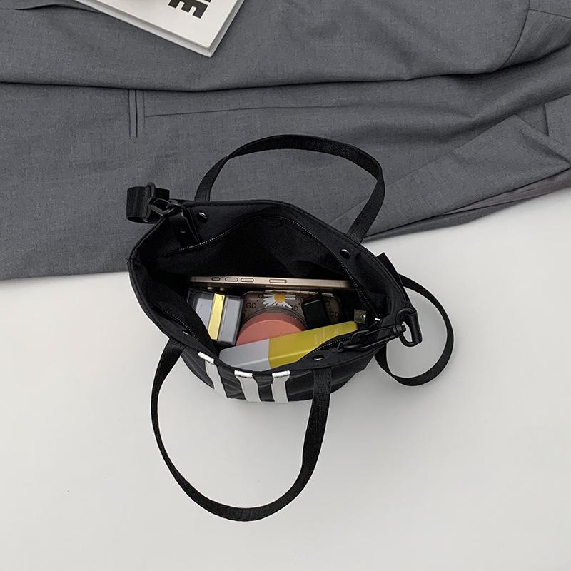 Hand-carrying Contrasting Striped Bucket Bag for Women's New Korean Style Niche Sports Commuter Shoulder Bag Versatile Crossbody Bag
